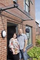 Former football star and family thrilled with new home Image